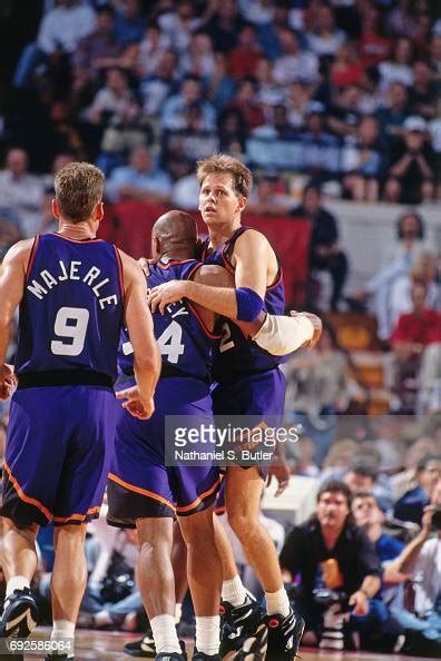 Danny Ainge And Charles Barkley Of The Phoenix Suns Hug During The