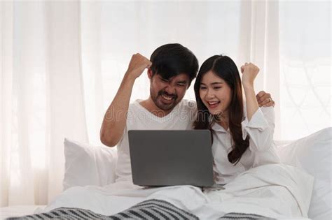 Beautiful Asian Couple In Love And Smiling Sitting On Bed Romantic Moment Relationships