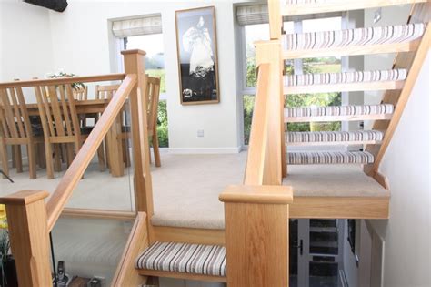 Open Tread Oak Staircase Renovation With Embedded Glass Balustrade