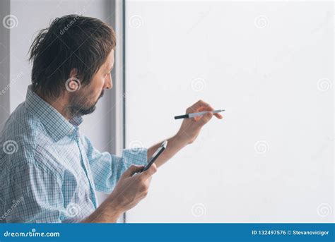 Businessman In Office Writing On Whiteboard Stock Photo Image Of