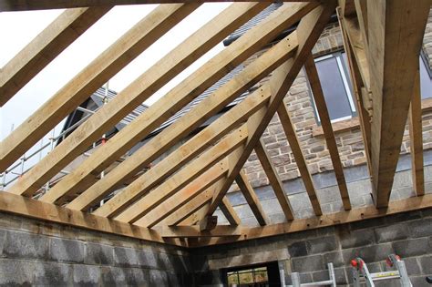 The first step in framing a hip roof is the same as a gable, find the run of a common rafter. Castle Ring Oak Frame | Timber framing, Roof construction ...