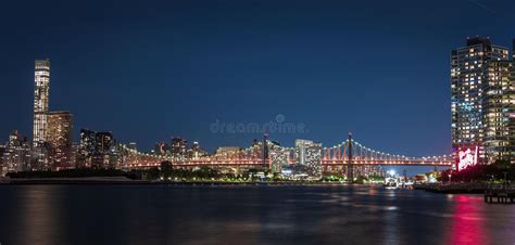Illuminated Queensborough Bridge With A Background Of Manhattan