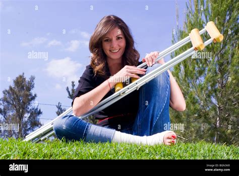 Pretty Woman With Cast Foot And Crutches Stock Photo Royalty Free