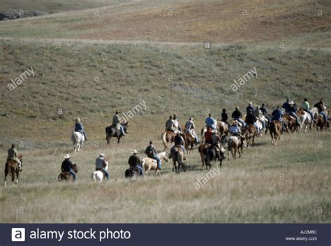 Many Horseback Riders Riding Off Into The Hills In Black Hills Custer