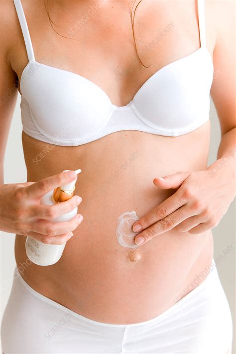 Pregnant Woman Applying Cream Stock Image C0312509