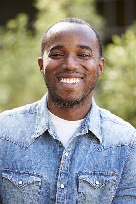 Happy Young African American Man In Denim Shirt Vertical Stock Image