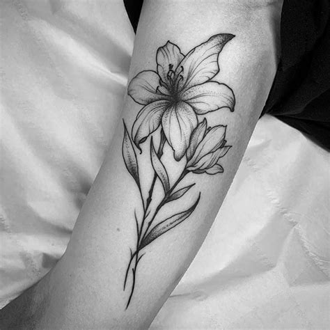 30 Botanical Floral Lily Tattoo Designs On Arms Bring A Touch Of