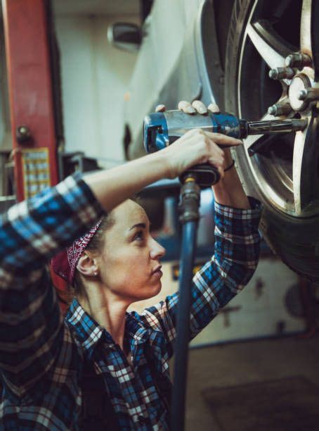 Female Mechanic Working On Car Tyre Service In 2021 Woman Mechanic
