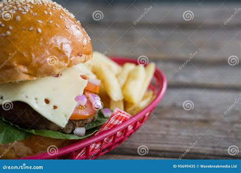 Close Up Of Cheeseburger And French Fries In Basket Stock Image Image