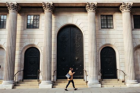 Woman Walking In Front Of Building Fundcalibre
