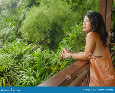 Young Beautiful And Happy Asian Chinese Woman Enjoying In Holidays Resort At Rice Terrace