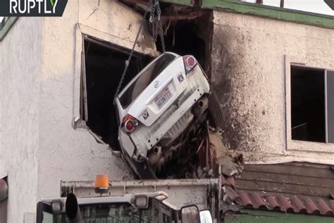 Watch This Driver Crash Into The Second Floor Of A Building Carbuzz