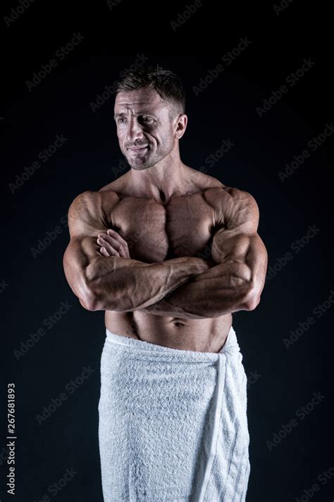 bodybuilder showing muscles sexy man in bath towel muscular body man after morning shower