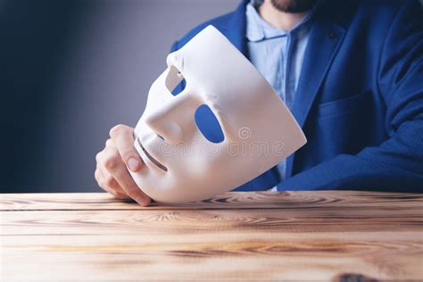 Businessman Holding White Mask In His Hand Stock Image Image Of