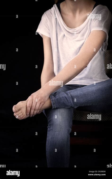 Woman Rubbing Sore Feet Stock Photo Alamy