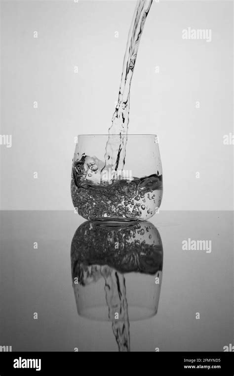 Pouring Water Into Glass Stock Photo Alamy
