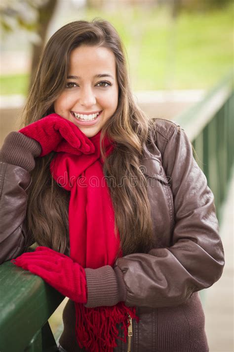 Smiling Teen Portrait Wearing Red Scarf And Mittens Outside Stock Image