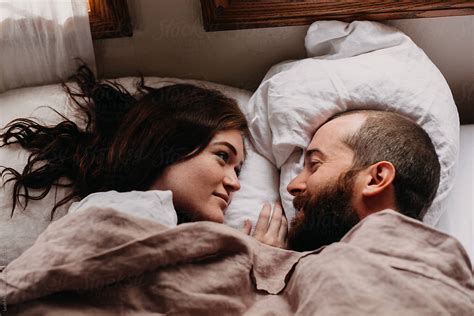 couple in bed together by stocksy contributor leah flores stocksy