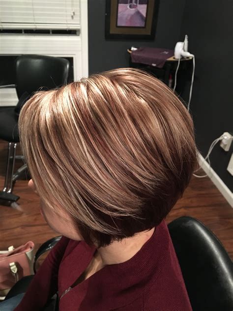 auburn back with auburn lowlights and frosty blonde highlights done by lindsey honzles short