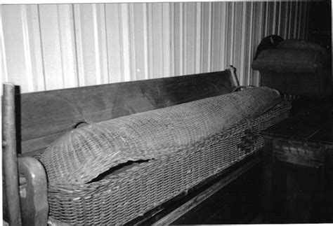 An Old Wicker Crib Is Shown In Black And White