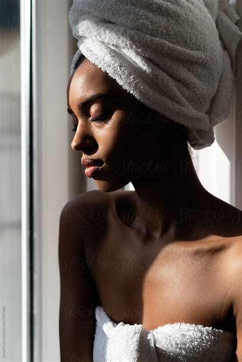 Beautiful Black Woman Wrapped In A Towel Del Colaborador De Stocksy