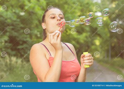 Young Woman Blowing Bubbles Stock Photo Image Of Blowing Caucasian