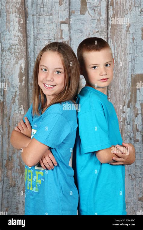 Twin Brother And Sister Posing Together In Studio Stock Photo Alamy