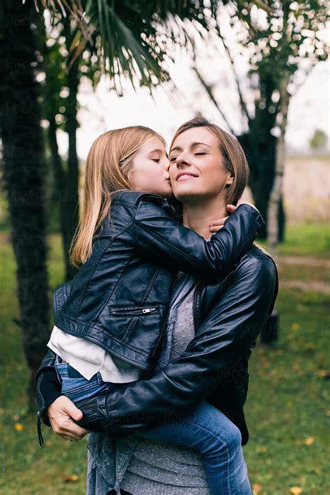 Mom Hugs Her Daughter In Nature By Stocksy Contributor Mauro