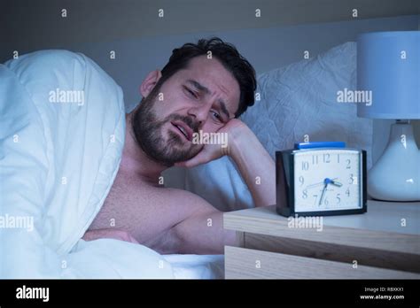 Stressed Sleepless Man Expression Lying In The Bed Stock Photo Alamy