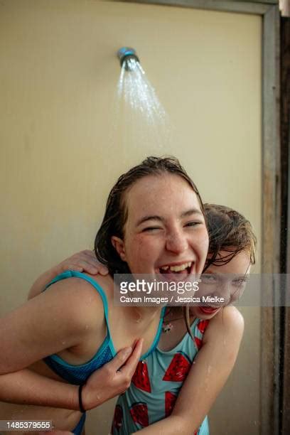 sister taking a shower photos and premium high res pictures getty images