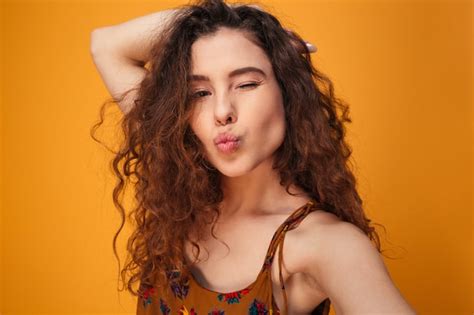 Premium Photo Close Up Portrait Of A Flirty Curly Haired Girl