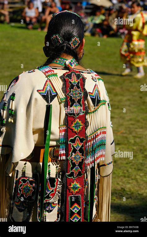 Native Indian Woman In Traditional Buckskin Regalia Judging A Dance