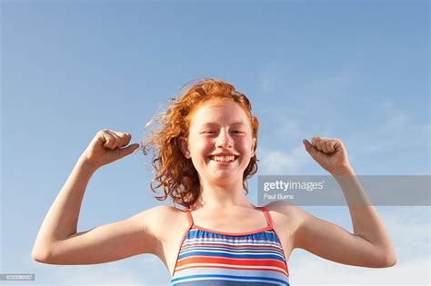 Girl Flexing Her Muscles High Res Stock Photo Getty Images