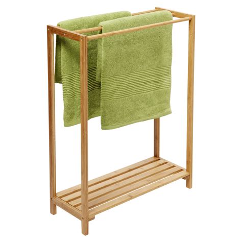 Crafted from metal, it features a tubular construction with two rods. Free Standing Towel Racks - HomesFeed