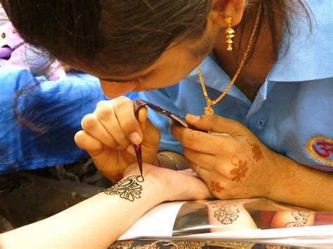 The henna plant, famous for rajastan, india, grows in warm climates. Artisan | Henna tattoo artist, Little India, Singapore ...