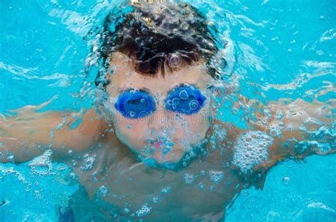 Little Kid With Underwater Goggles In Swimming Pool Stock Photo Image