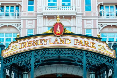 Disneyland Paris Amusement Park Sign It Is Located Under Mickey Mouse