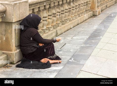 Poor Woman Begging In The Street Stock Photo Alamy