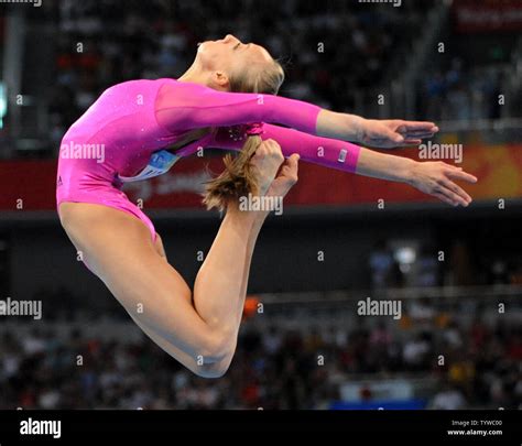 Usas Nastia Liukin Soars High Above The Balance Beam During Her Performance In The Womens