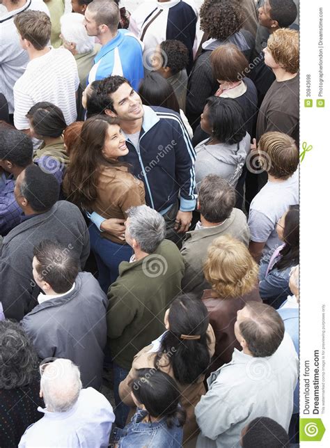 Couple Facing The Other Direction From The Multiethnic Crowd Stock