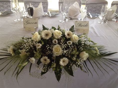 I should have guessed he would sabotage my wedding, but i didn't. Top table arrangement | Wedding table flowers, Bridal ...