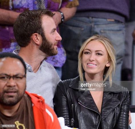 Dustin Johnson And Paulina Gretzky Attend A Basketball Game Between