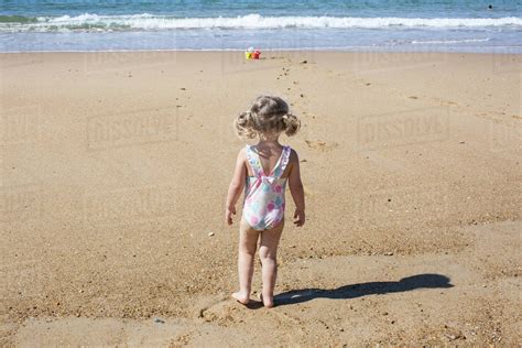 Little Girl At The Beach Rear View Stock Photo Dissolve