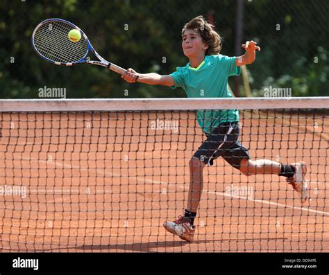 Young Boy Playing Tennis Stock Photo Alamy