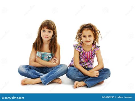 A Child Two Girls Sitting On The Floor Stock Photo Image Of Cutie
