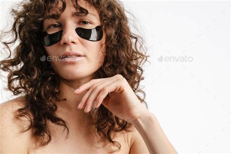 Half Naked Woman Looking At Camera While Posing With Eye Patches Stock Photo By Vadymvdrobot