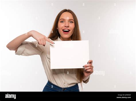 The Girl Is Holding A Sheet Of Paper In Front Of Her Stock Photo Alamy