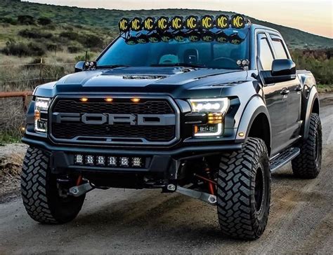 Lifted ford raptor with kc off-road lightbar. find out more about this