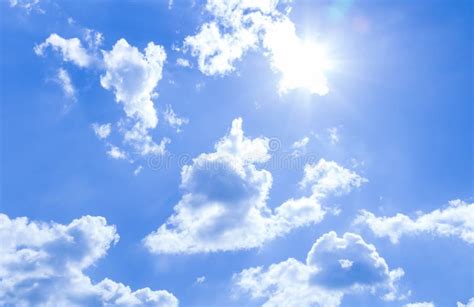 Natural Sky Background And Radiating Rays In A Blue Sky With Clouds