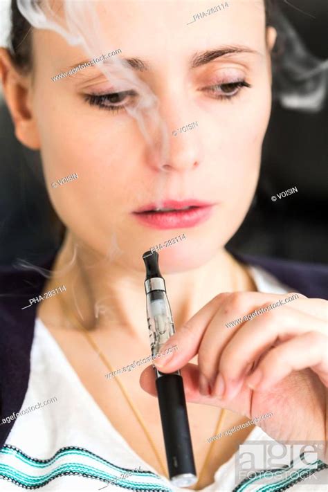 Woman Smoking Electronic Cigarette Stock Photo Picture And Rights